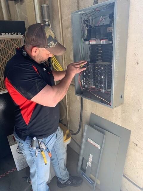 Commercial Electrician working on electrical panel